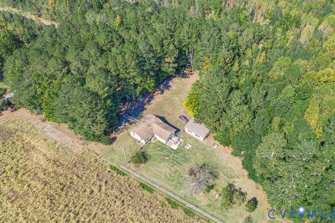 14421 Alden Road, Disputanta, VA 23842 Aerial perspective of a detached residence and secondary structure situated on a large, level lot featuring expansive lawn space and mature woodland boundaries