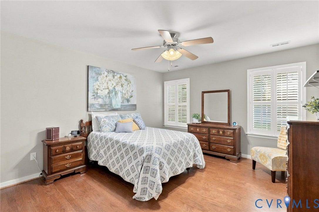 8146 Janice Avenue, Mechanicsville, VA 23111 Wood-finish flooring, ceiling fan with integrated lighting, and white interior plantation shutters