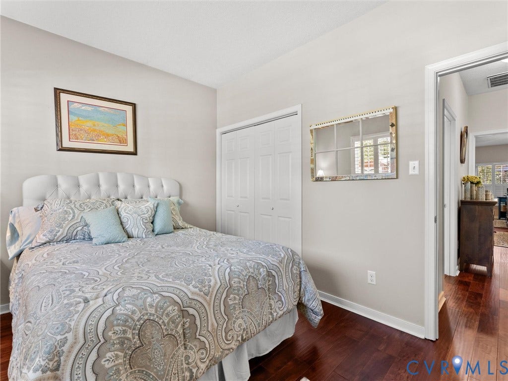 4105 English Holly Circle, Glen Allen, VA 23294 Room with wood-finish flooring, dual-panel closet doors, and neutral wall paint