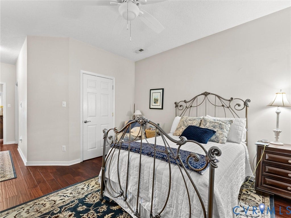 4105 English Holly Circle, Glen Allen, VA 23294 Vaulted ceiling with integrated paddle fan and warm-toned wood-finish flooring