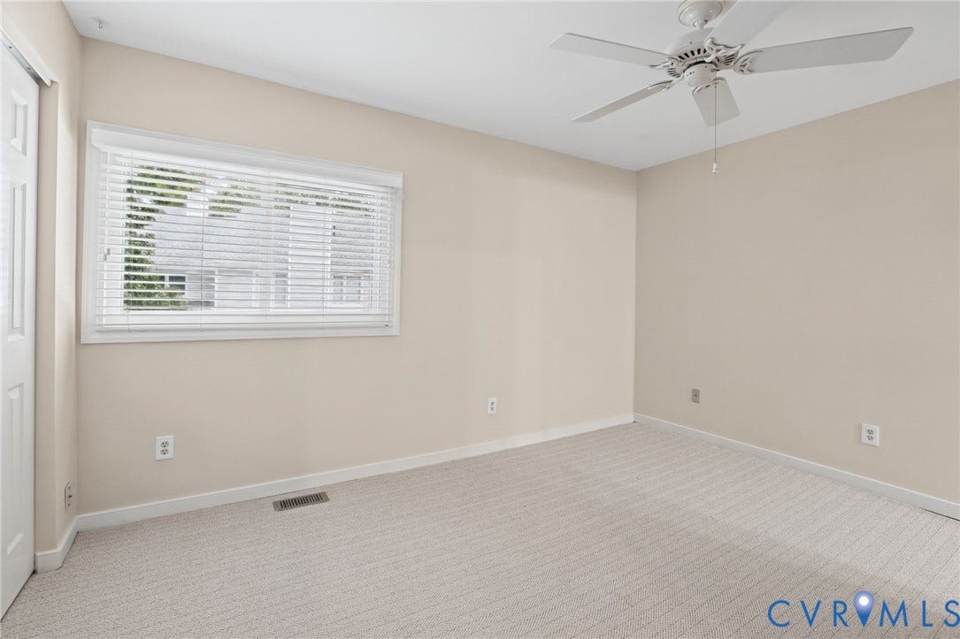 1415 Sycamore Mews Circle, Sycamore Mews, Midlothian, VA 23113 Neutral-toned interior featuring wall-to-wall carpeting, ceiling-mounted paddle fan, and horizontal slat window blinds