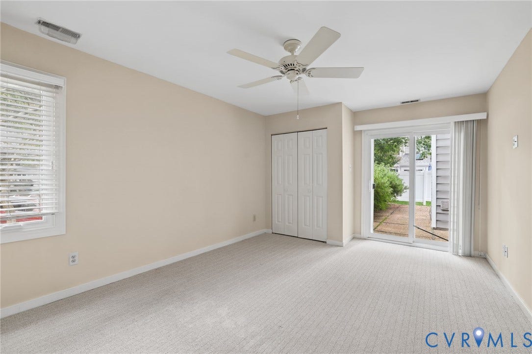 1415 Sycamore Mews Circle, Sycamore Mews, Midlothian, VA 23113 Room featuring neutral carpeting, a ceiling fan, closet with double doors, and a sliding glass door providing external access