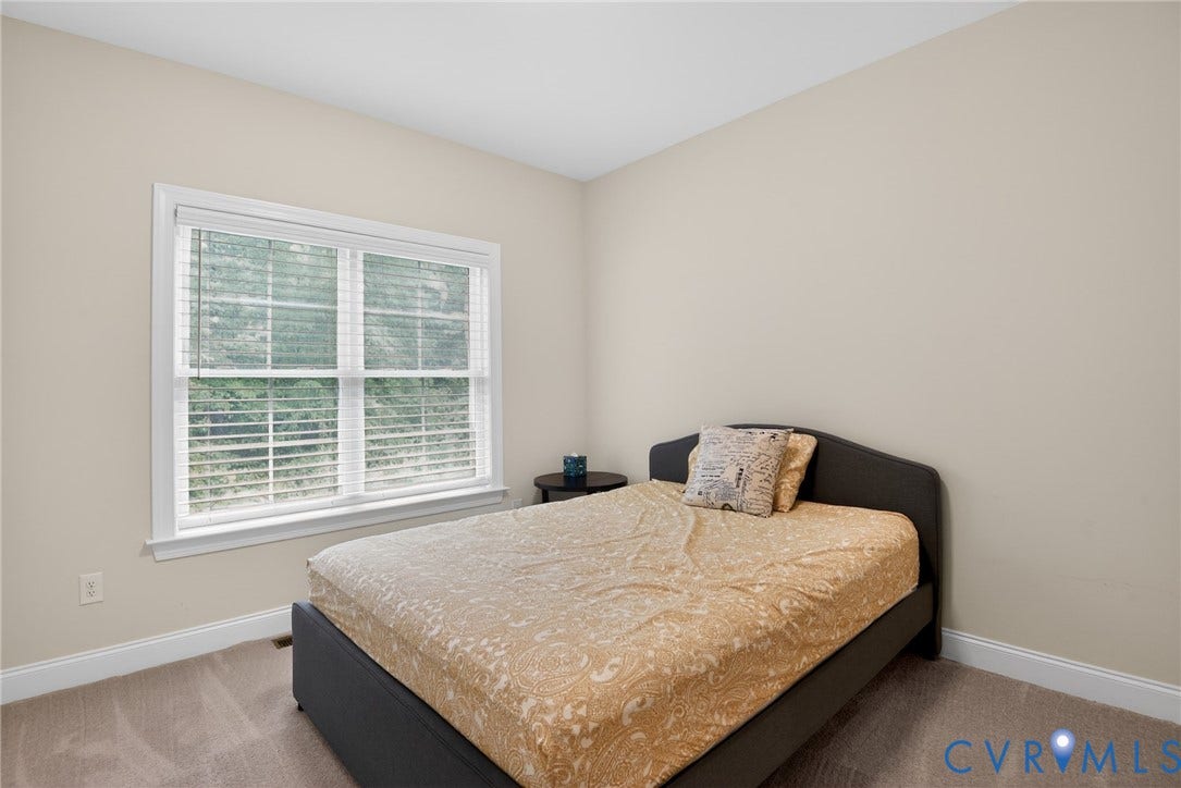 Glen Allen, VA 23059 Neutral interior walls, wall-to-wall carpeting, and a double-hung window with white trim