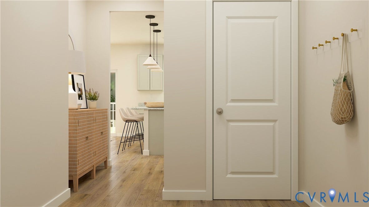 17313 Gossamer Drive, Chesterfield, VA 23120 Interior space featuring wood-finish flooring, a two-panel interior door with a circular knob, and wall-mounted brass hardware