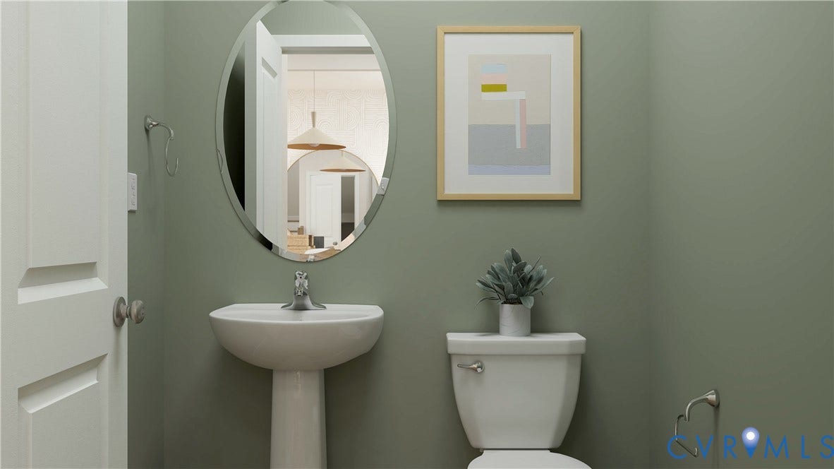 17313 Gossamer Drive, Chesterfield, VA 23120 Oval wall-mounted mirror above a white pedestal sink, paired with a chrome single-handle faucet and a standard porcelain toilet