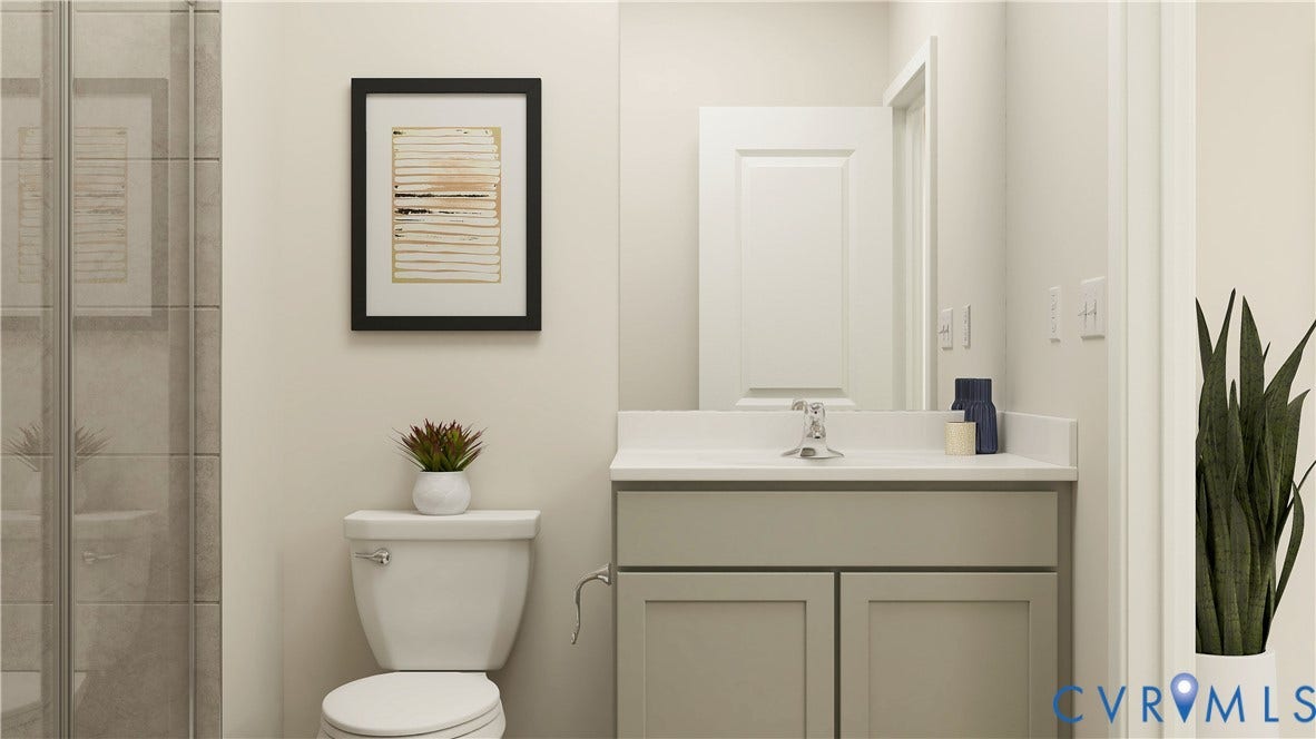 17313 Gossamer Drive, Chesterfield, VA 23120 Bathroom featuring a vanity with a light-toned countertop, shaker-style cabinetry, a polished chrome faucet, and a glass-enclosed shower