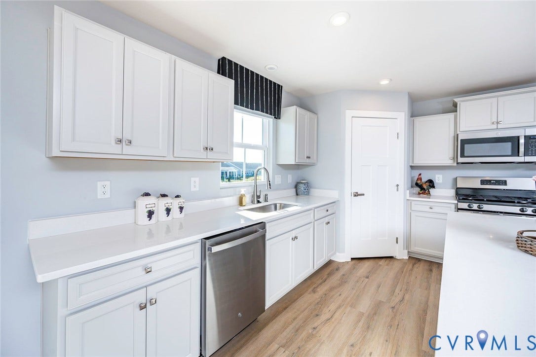 7577 Southamptonshire Way, Autum Pines, New Kent, VA 23124 Kitchen featuring white shaker-style cabinetry, gas stove & tons of counter space