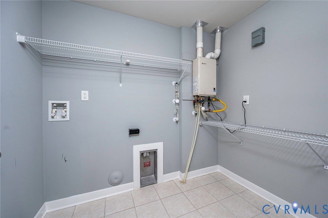 7577 Southamptonshire Way, Autum Pines, New Kent, VA 23124 Utility room featuring tile flooring, washer dryer hookups, wall-mounted tankless water heater and shelving