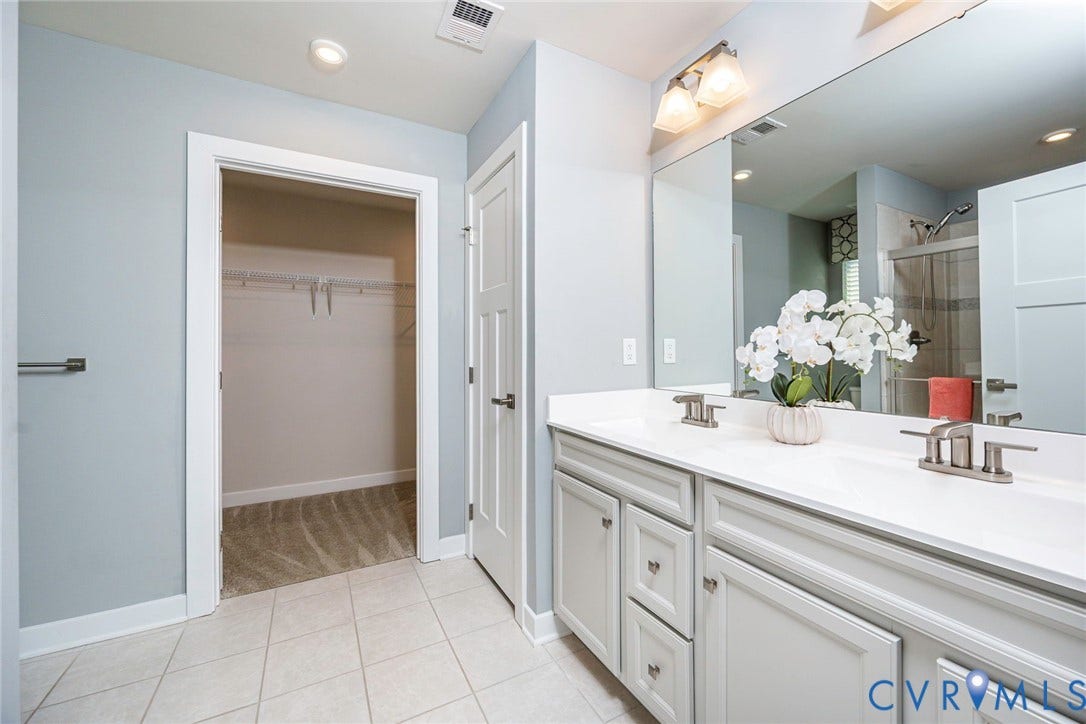 7577 Southamptonshire Way, Autum Pines, New Kent, VA 23124 Primary Bedroom with Attached Bathroom with dual vanity,linen closet, tiled flooring and large walk-in closet