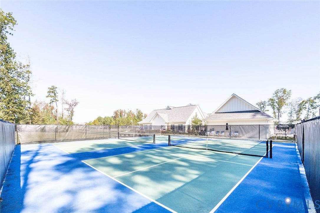 7577 Southamptonshire Way, Autum Pines, New Kent, VA 23124 Hard-court sports surface enclosed by perimeter fencing and netting