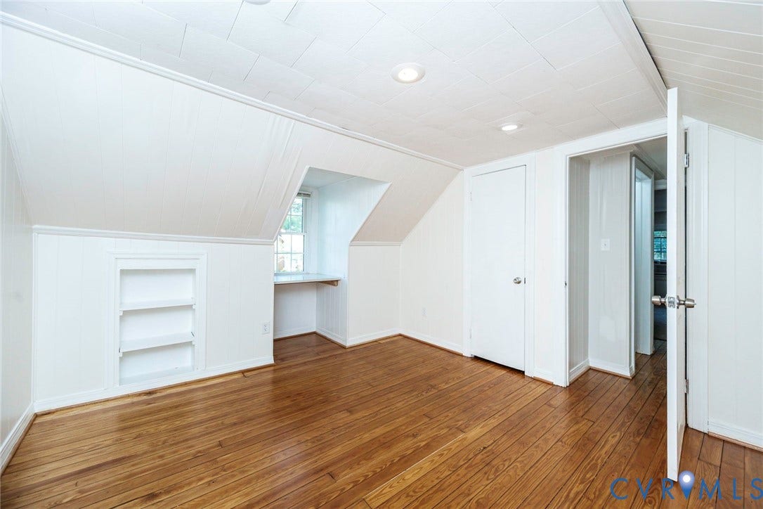 3017 Kingsdale Road, Chesterfield, VA 23237 Room featuring wood-finish flooring, white panel walls, recessed lighting, built-in shelving, and a recessed nook with a built-in workspace