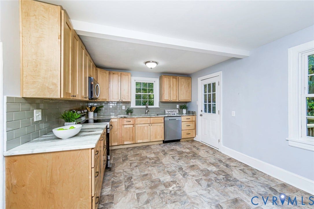 3017 Kingsdale Road, Chesterfield, VA 23237 Kitchen featuring light wood cabinetry, stone-finish countertops, subway tile backsplash, stainless steel appliances, and tile flooring