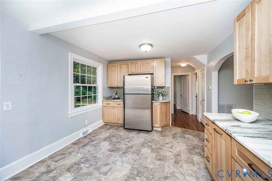 3017 Kingsdale Road, Chesterfield, VA 23237 Kitchen featuring light-toned wood cabinetry, stainless steel refrigerator, stone-patterned countertops, and tile-style flooring