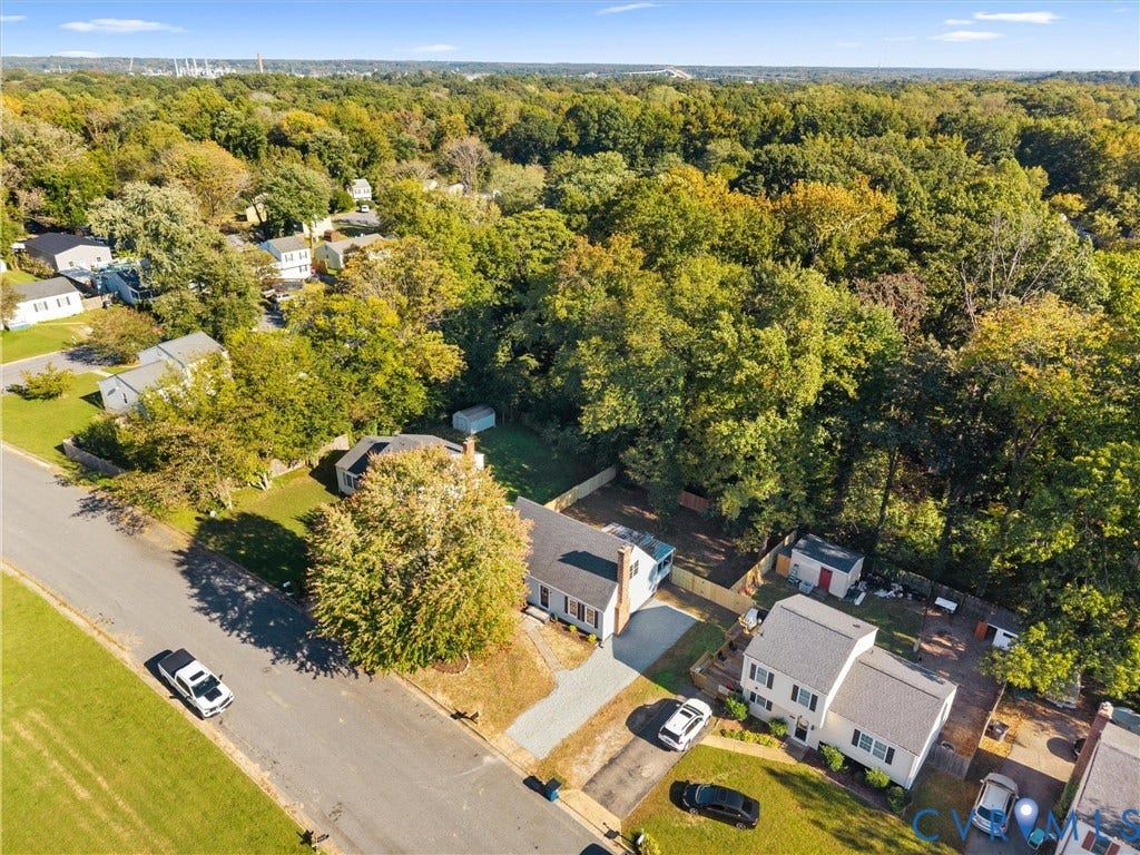 5105 Carryback Drive, Richmond, VA 23234 Aerial perspective of residential properties featuring paved driveways, established mature trees, and fenced yards