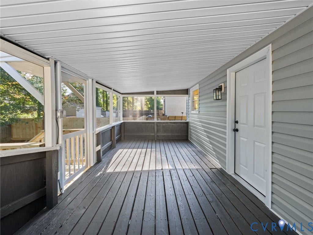5105 Carryback Drive, Richmond, VA 23234 Screened-in porch featuring painted wood decking, a beadboard ceiling, horizontal lap siding, and a six-panel exterior door