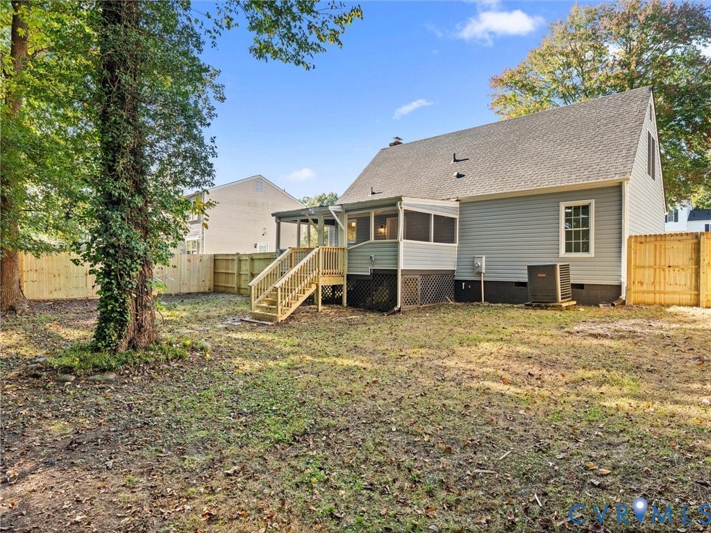 5105 Carryback Drive, Richmond, VA 23234 Rear exterior featuring a screened-in porch with wooden stairs, vinyl siding, a fenced perimeter, and mature trees