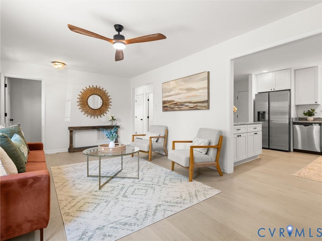 5105 Carryback Drive, Richmond, VA 23234 Living area featuring wood-finish flooring, a contemporary ceiling fan with integrated lighting, and neutral wall tones