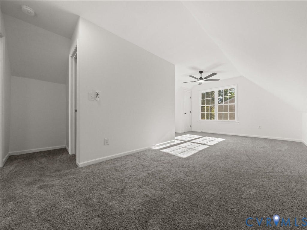 5105 Carryback Drive, Richmond, VA 23234 Neutral-toned wall-to-wall carpeting, vaulted ceiling with architectural lines, multi-pane window, and integrated ceiling fan
