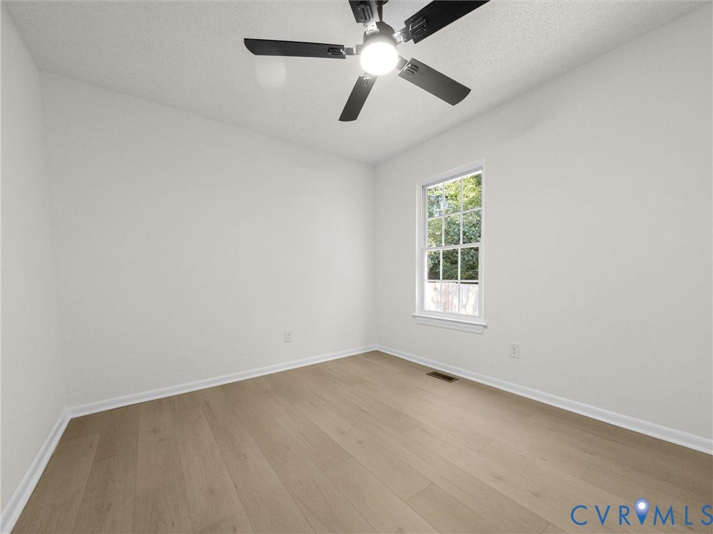 5105 Carryback Drive, Richmond, VA 23234 Room featuring wood-finish flooring, a multi-blade ceiling fan with integrated lighting, and a single-hung window with muntin detailing