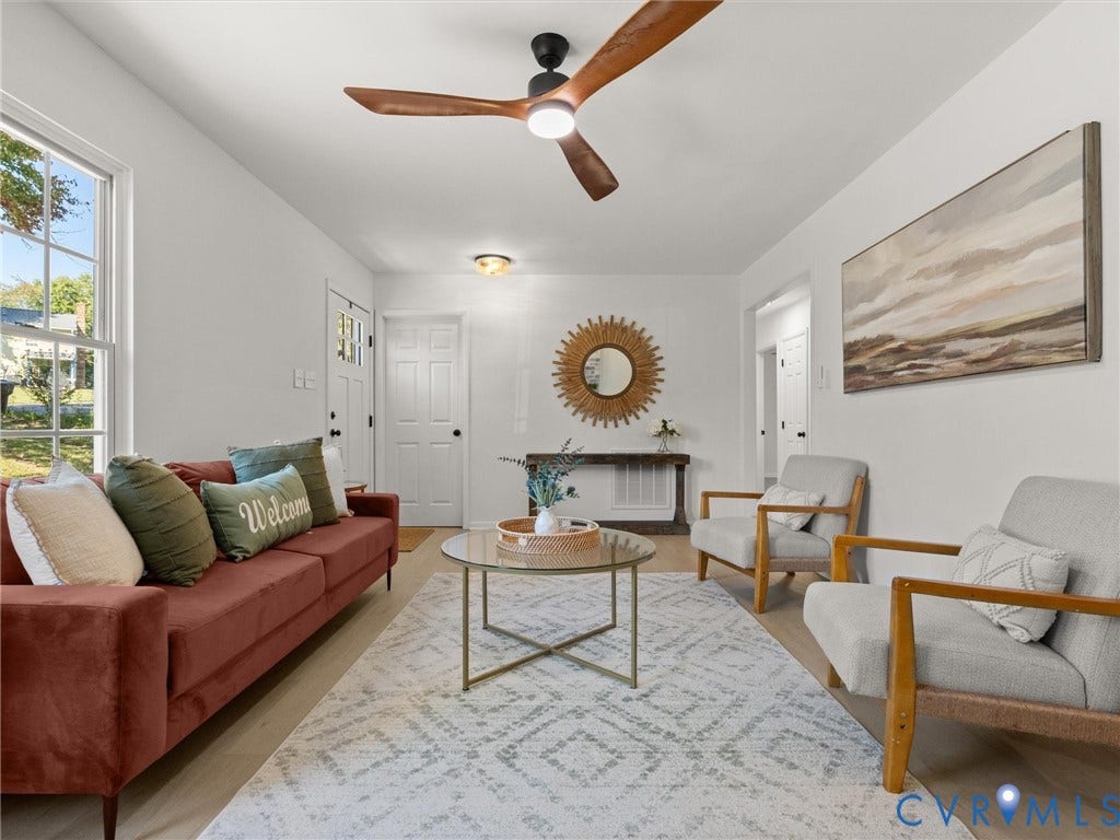 5105 Carryback Drive, Richmond, VA 23234 Living area featuring wood-finish flooring, a multi-blade ceiling fan with integrated lighting, and multi-pane window