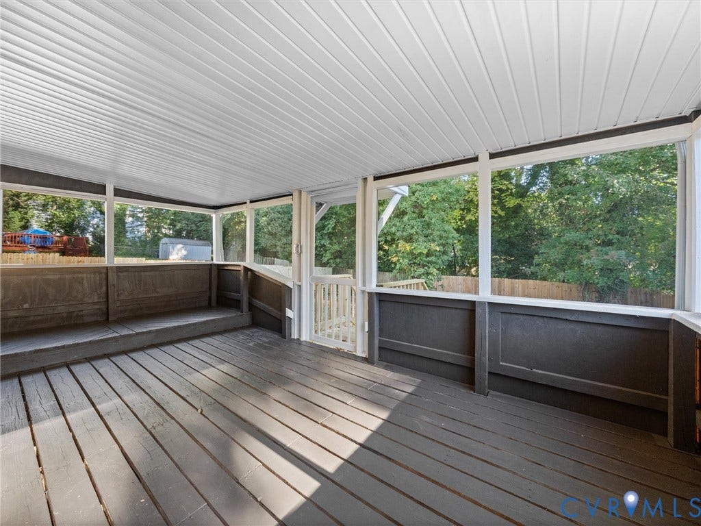 5105 Carryback Drive, Richmond, VA 23234 Screened-in porch featuring wood-plank flooring, white paneled ceiling, built-in wooden bench seating, and an integrated screen door