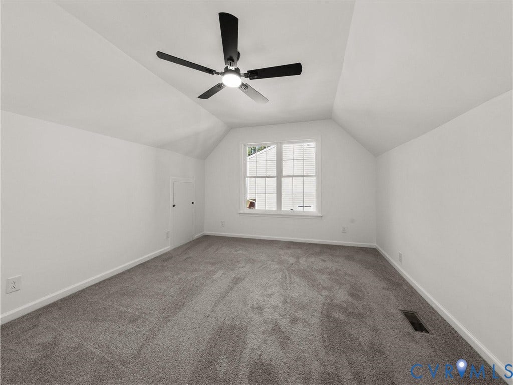 5105 Carryback Drive, Richmond, VA 23234 Vaulted ceiling, wall-to-wall carpeting, matte black ceiling fan with integrated lighting, and an access panel to attic storage