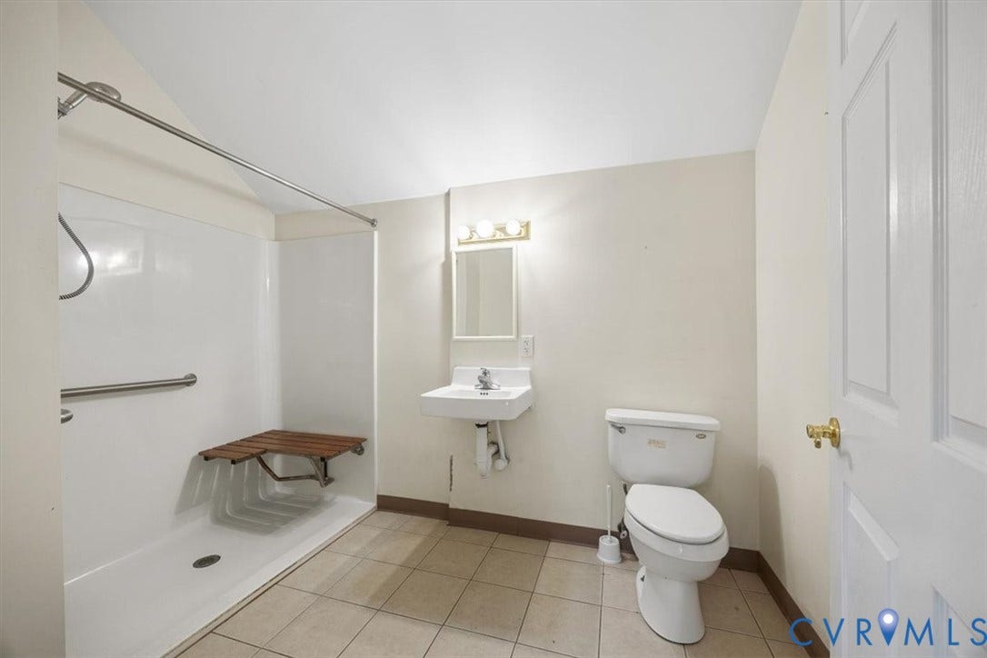 108 Jankin Lane, Sandston, VA 23150 Full ensuite bath with walk-in shower, grab bar and wheelchair accessible sink adjacent to First floor Bed #2