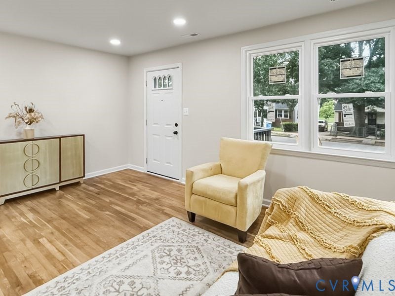 2500 ford Avenue, Richmond, VA 23223 Interior space featuring wood-finish flooring, recessed lighting, neutral wall paint, and dual-pane windows with grid detailing