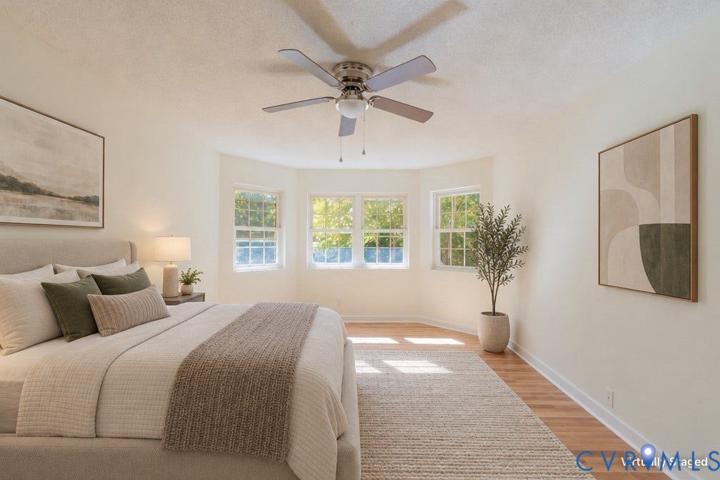9045 Blounts Corner Road, Smithfield, VA 23430 Room featuring a bay window, wood-finish flooring, and a multi-blade ceiling fan with an integrated light fixture