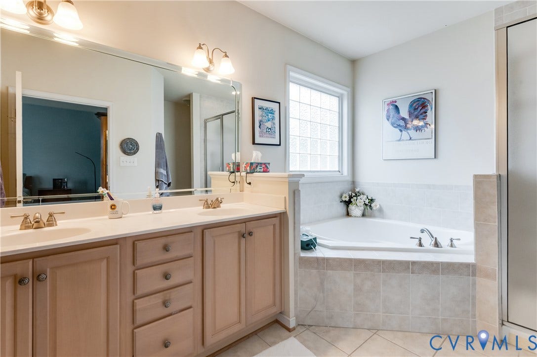 704 Taylors Hill Court, Manakin Sabot, VA 23103 Dual vanity featuring integrated sinks and ample storage cabinetry