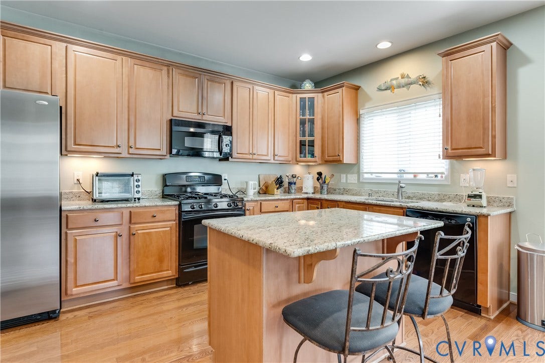 704 Taylors Hill Court, Manakin Sabot, VA 23103 Kitchen featuring light wood cabinetry, granite countertops, an undermount sink, recessed lighting, and wood-finish flooring