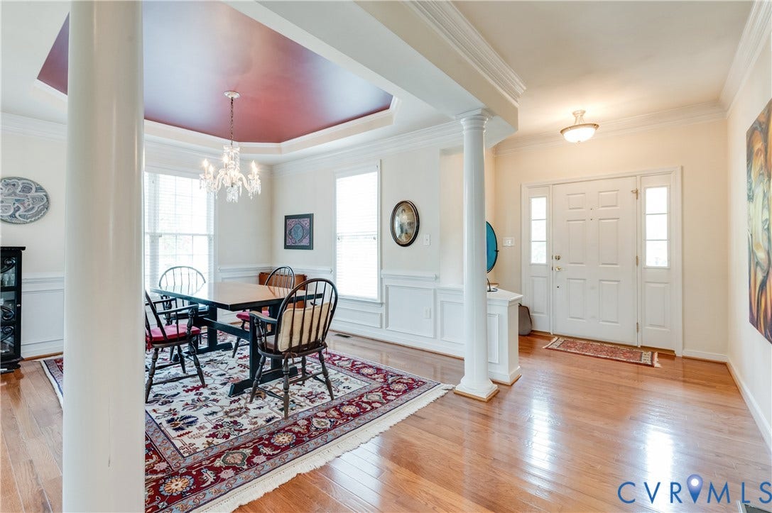 704 Taylors Hill Court, Manakin Sabot, VA 23103 Open concept dining area with a tray ceiling and chandelier lighting