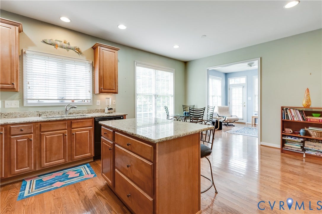 704 Taylors Hill Court, Manakin Sabot, VA 23103 Kitchen featuring wood-finish flooring, recessed lighting, wood cabinetry, stone countertops, and a center island