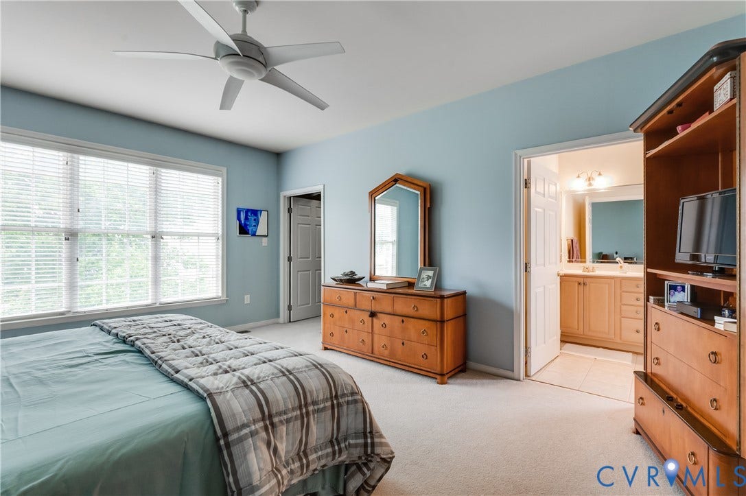 704 Taylors Hill Court, Manakin Sabot, VA 23103 Bedroom featuring light blue walls, soft carpet flooring, and a ceiling fan