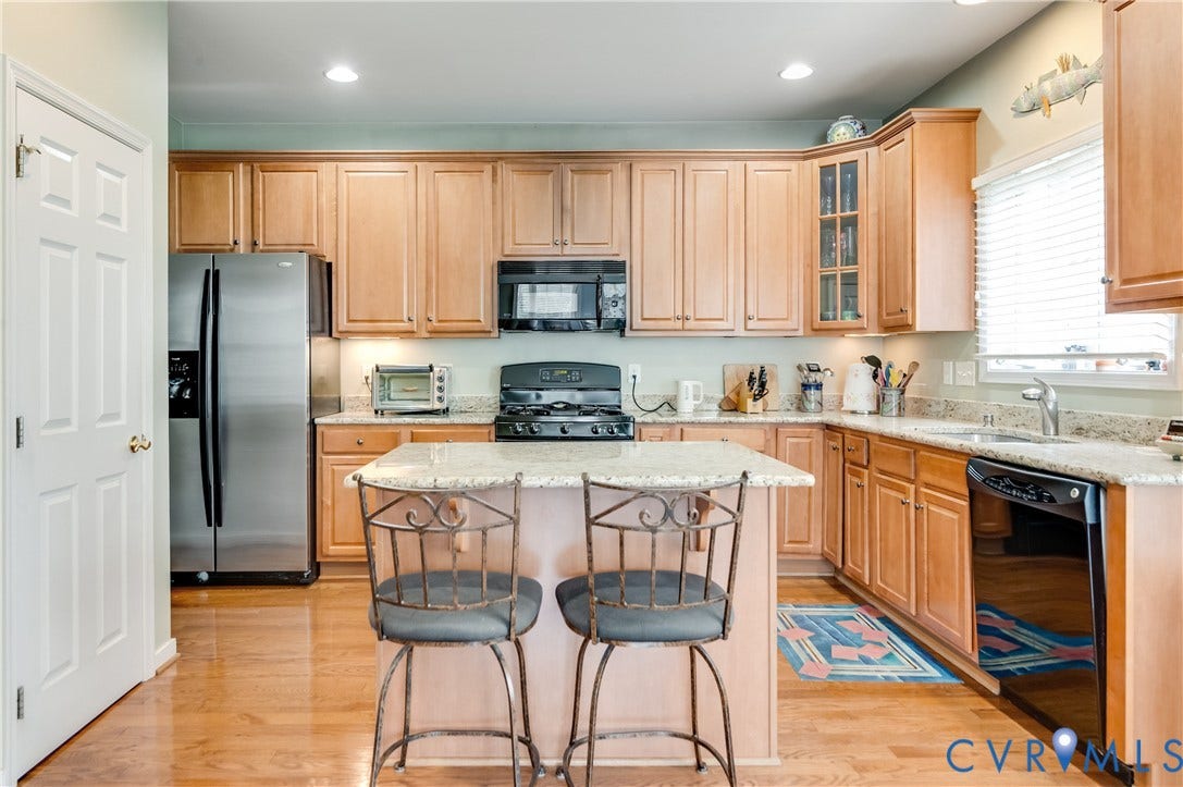 704 Taylors Hill Court, Manakin Sabot, VA 23103 Kitchen featuring wood-finish flooring, recessed lighting, wood cabinetry, stone countertops, and stainless steel appliances