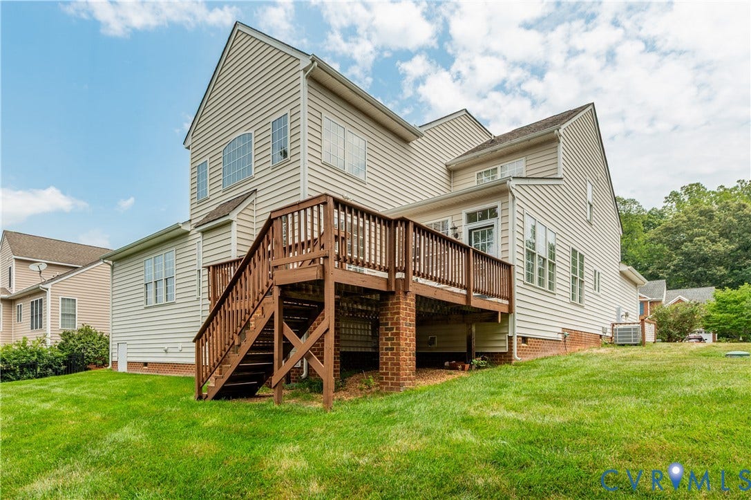 704 Taylors Hill Court, Manakin Sabot, VA 23103 Multi-level rear deck with brick columns and stairs to a graded lawn