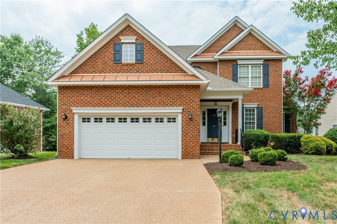 704 Taylors Hill Court, Manakin Sabot, VA 23103 Brick-front residence featuring a two-car garage with transom windows