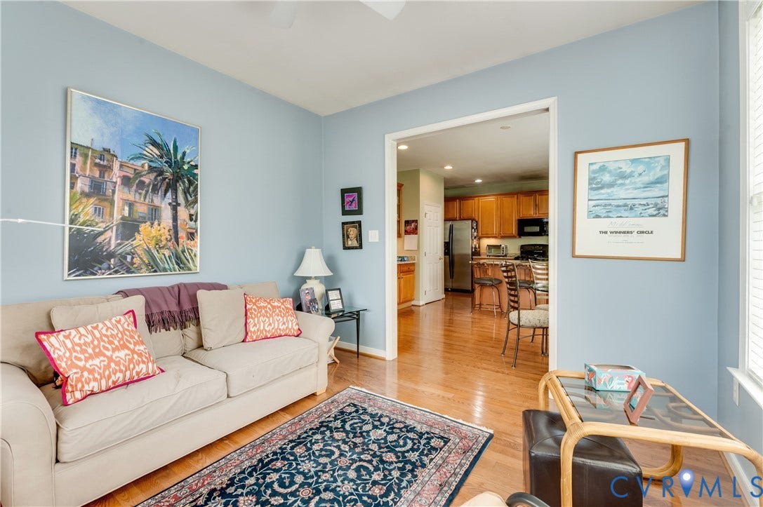 704 Taylors Hill Court, Manakin Sabot, VA 23103 Living area featuring wood-finish flooring and light blue wall tones