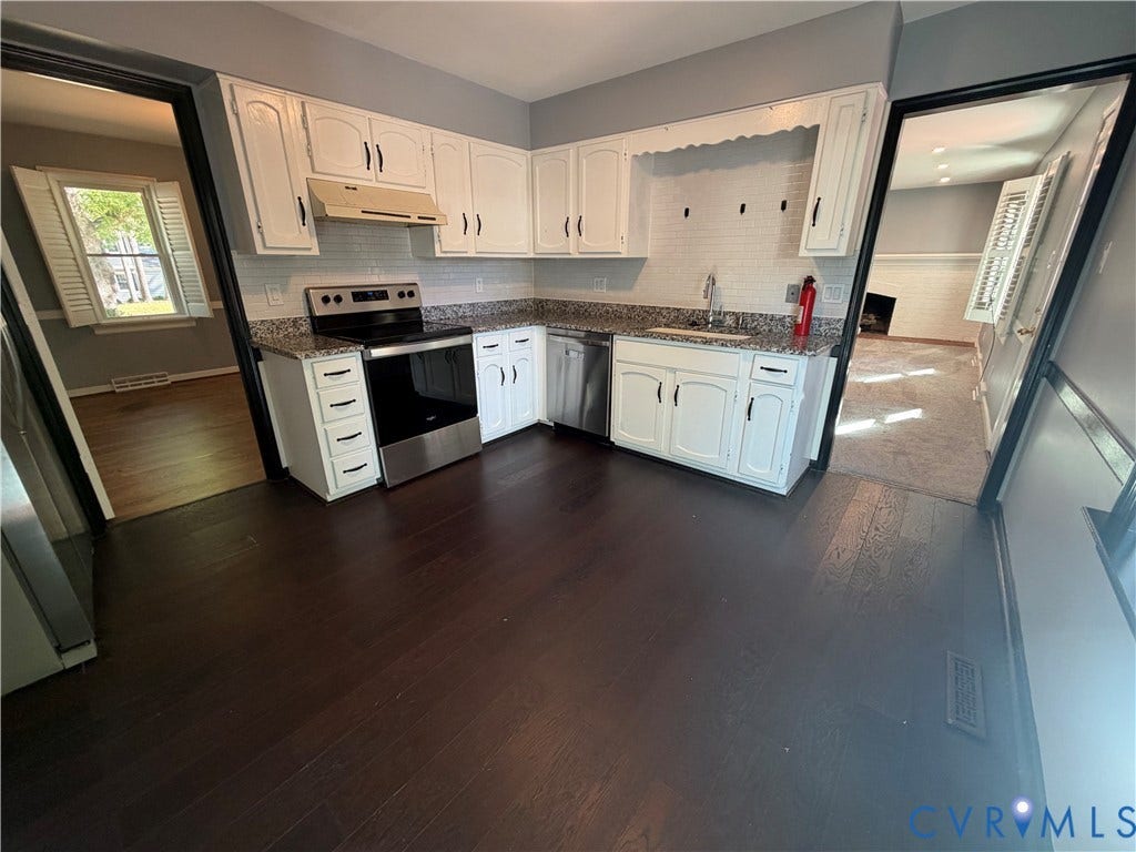 2228 Early Settlers Road, Midlothian, VA 23235 Kitchen featuring white cabinetry, stone-finish countertops, subway tile backsplash, stainless steel appliances, and dark-toned wood-finish flooring