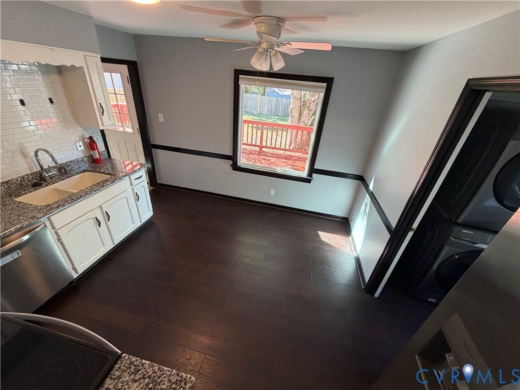 2228 Early Settlers Road, Midlothian, VA 23235 Wood-finish flooring, white cabinetry, speckled stone-finish countertops, subway tile backsplash, and ceiling fan with integrated lighting