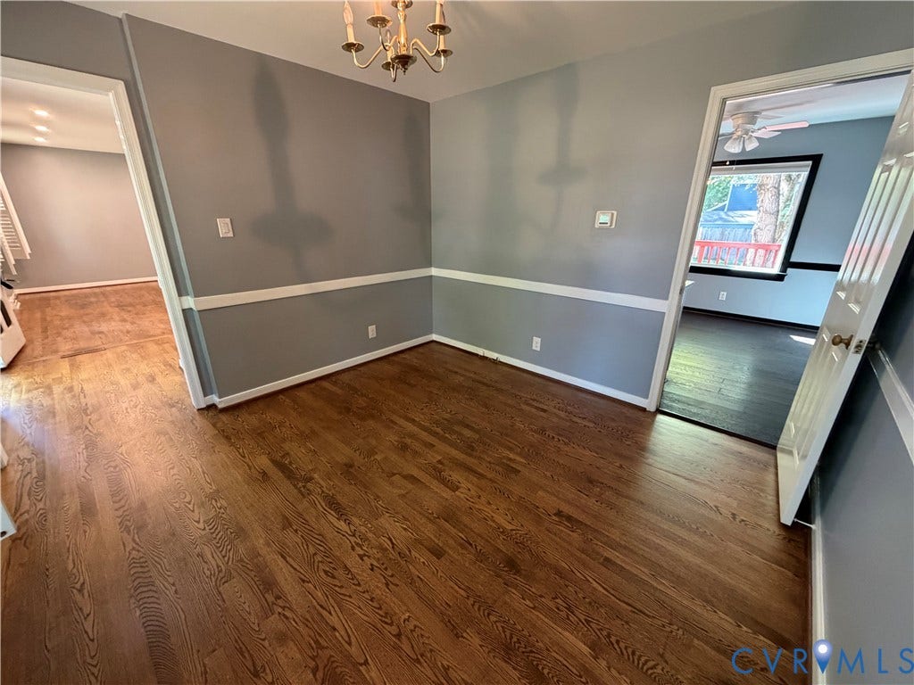 2228 Early Settlers Road, Midlothian, VA 23235 Interior space featuring hardwood flooring, white chair rail molding, and a multi-arm ceiling-mounted light fixture