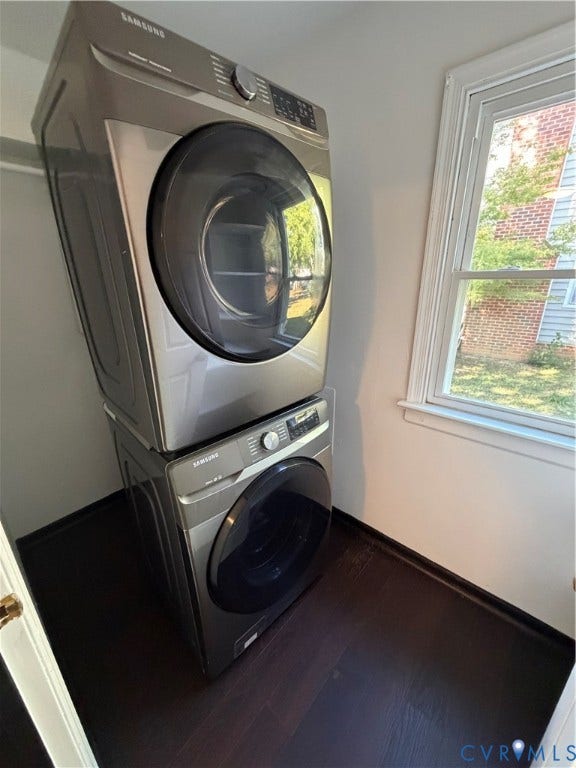 2228 Early Settlers Road, Midlothian, VA 23235 Stacked metallic-finish front-load laundry appliances, dark wood-finish flooring, and a window with exterior brick exposure