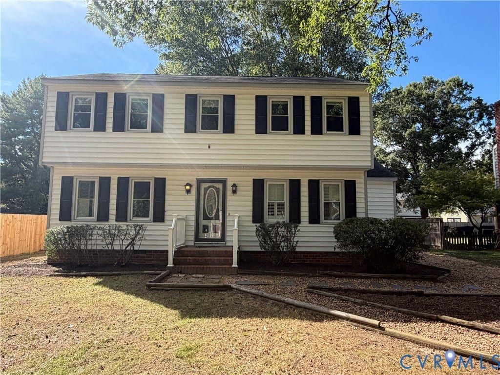 2228 Early Settlers Road, Midlothian, VA 23235 Two-story colonial exterior featuring light-colored siding, dark shutters, brick foundation detailing, a centered glass-panel front door, and a brick front porch