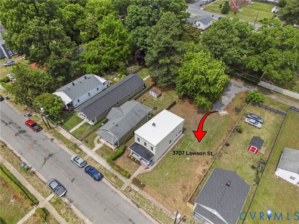 3707 Lawson Street, Swansboro West, Richmond, VA 23224 Aerial view of a rectangular residential lot featuring a two-story structure, clear building footprint, and expansive grass grounds with mature perimeter trees