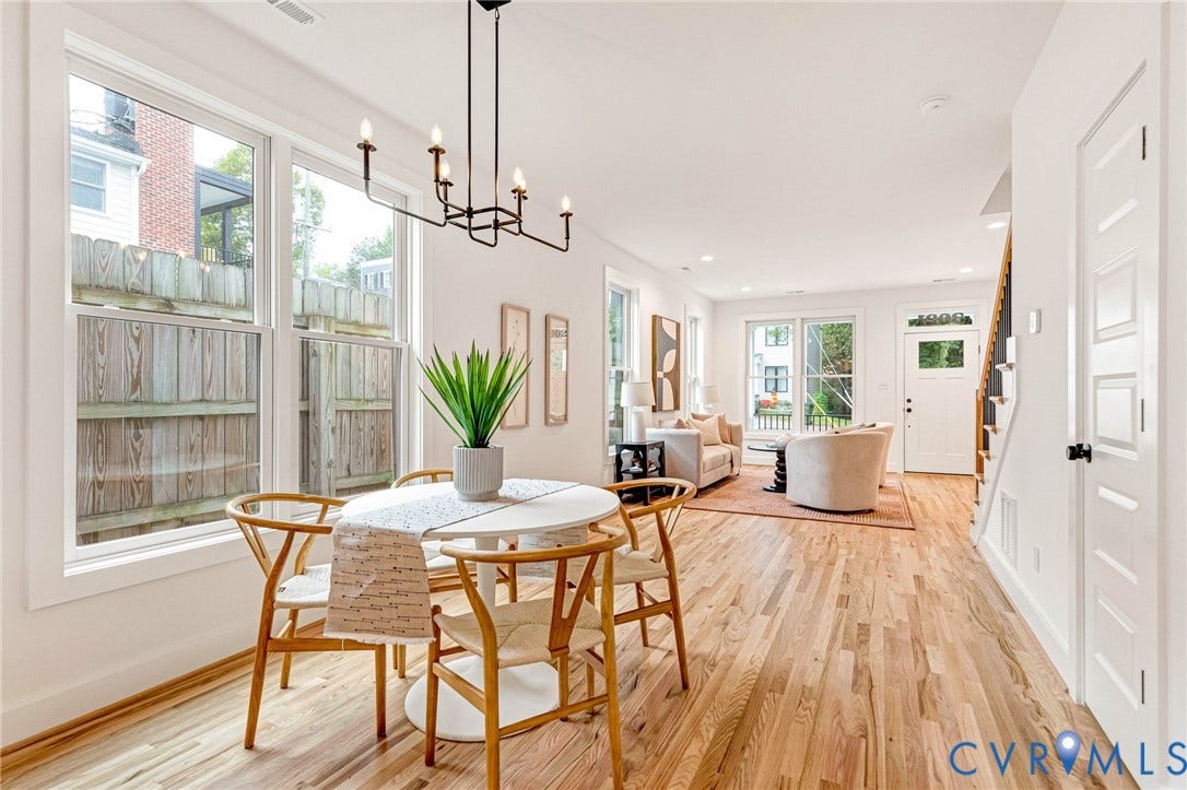 3021 E Franklin Street, St. John's Church, Richmond, VA 23223 Open-concept living space featuring wood-finish flooring, multi-pane windows, recessed lighting, and a six-light candelabra chandelier