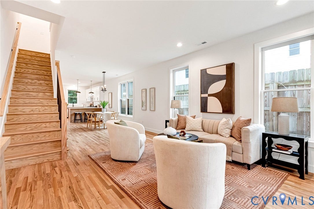 3021 E Franklin Street, St. John's Church, Richmond, VA 23223 Open-concept interior featuring wood-finish flooring, staircase with wood treads, recessed lighting, and multiple windows