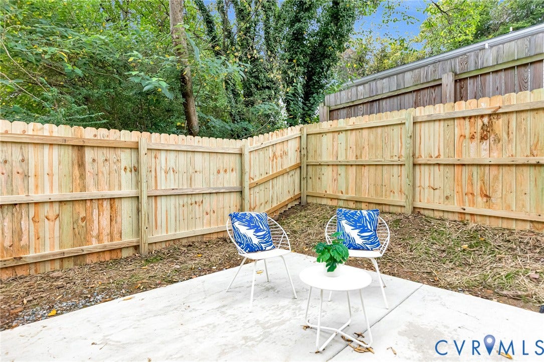 3021 E Franklin Street, St. John's Church, Richmond, VA 23223 Concrete patio area enclosed by a wood privacy fence