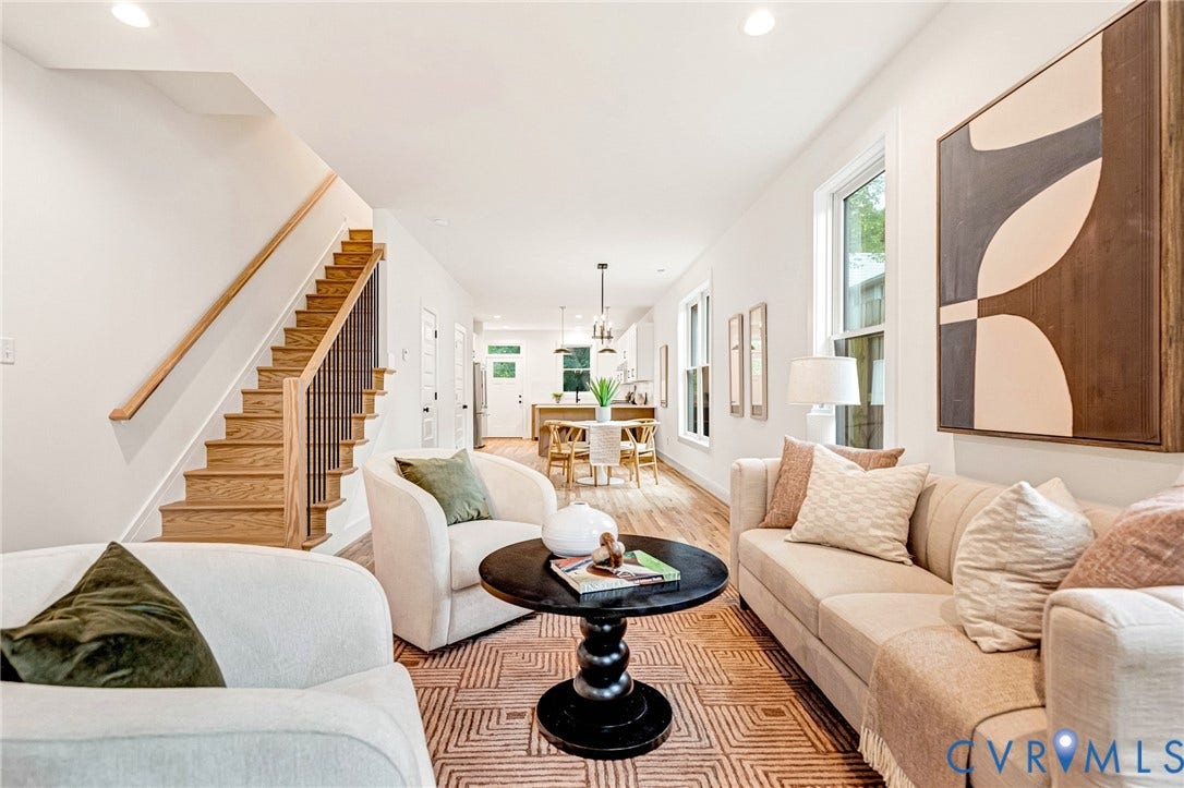 3021 E Franklin Street, St. John's Church, Richmond, VA 23223 Open interior featuring wood-finish flooring, staircase with wood treads and metal balusters, recessed lighting, and multiple windows