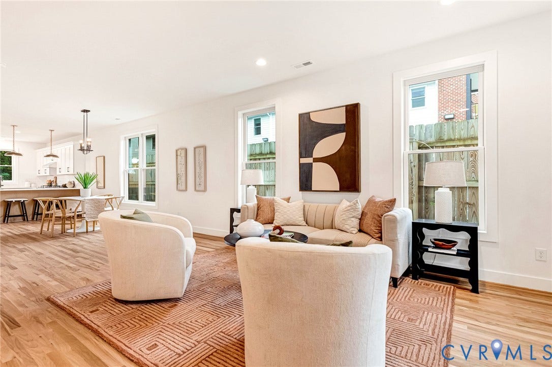 3021 E Franklin Street, St. John's Church, Richmond, VA 23223 Open-concept living space featuring wood-finish flooring, recessed lighting, multiple oversized windows, and crisp white walls