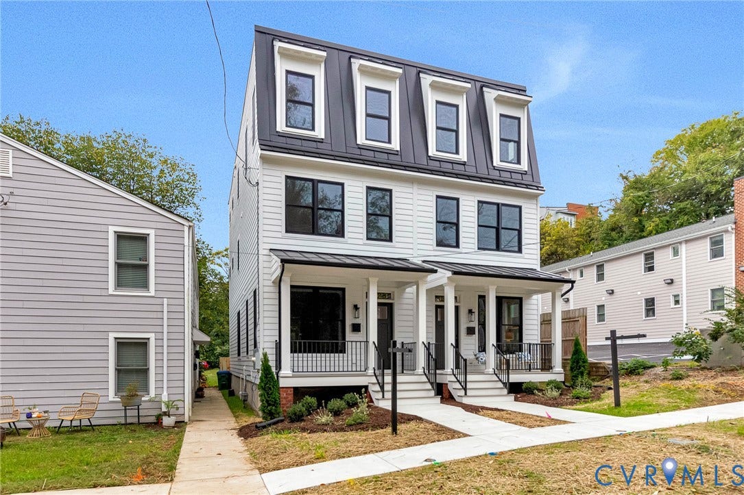 3021 E Franklin Street, St. John's Church, Richmond, VA 23223 Three-story townhouse featuring horizontal siding, a mansard roofline with dormer windows, metal roofing accents, and covered front porches with black metal railings